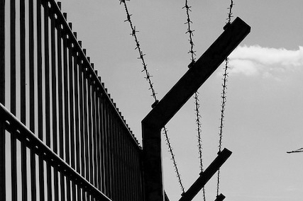 security fence with barbed wire
